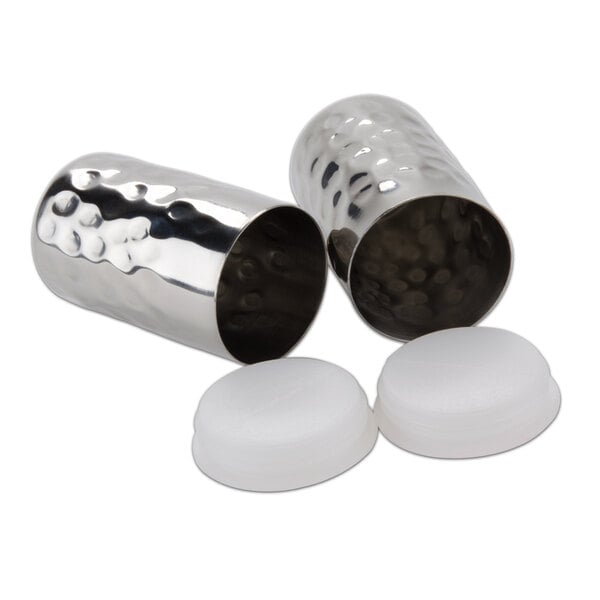 A close-up of a silver cylinder with a white lid.