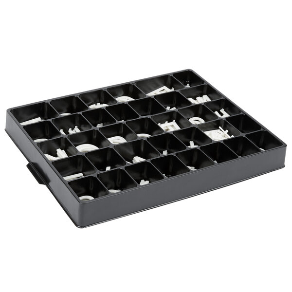A black tray with Aarco Helvetica universal single tab letters and numbers in it.