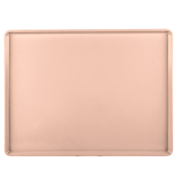 A rectangular light pink Cambro dietary tray.
