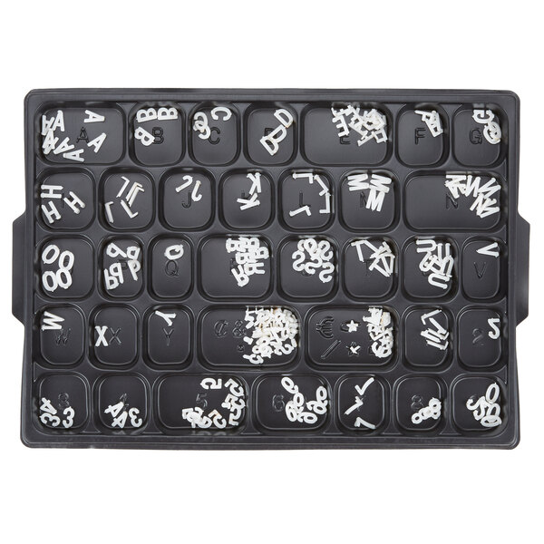 A black tray with white Aarco Helvetica letters and numbers.