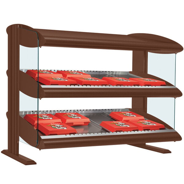 An Antique Copper Hatco double shelf merchandiser with red and brown shelves holding red boxes of food.