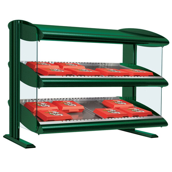 A Hunter green Hatco slanted double shelf countertop display case with red boxes inside.