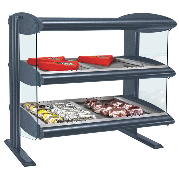 A Hatco heated zone merchandiser with shelves of food on a countertop.