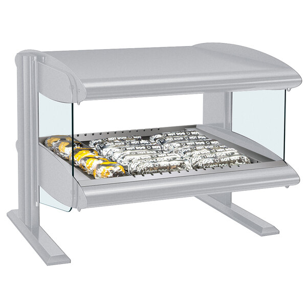 A Hatco white granite countertop heated zone merchandiser with food on a silver tray.