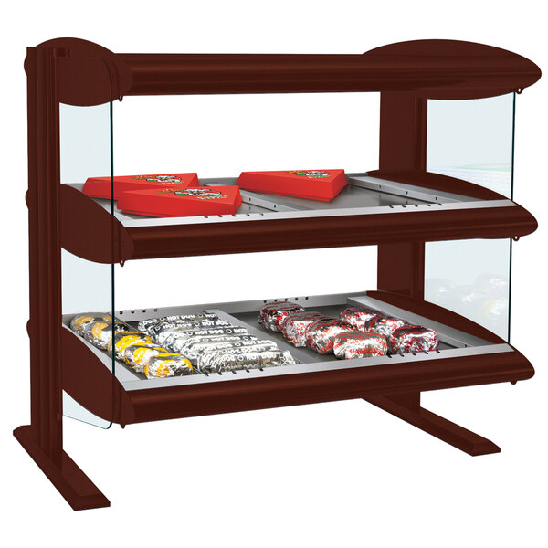 A Hatco horizontal double shelf heated zone merchandiser with food on it.