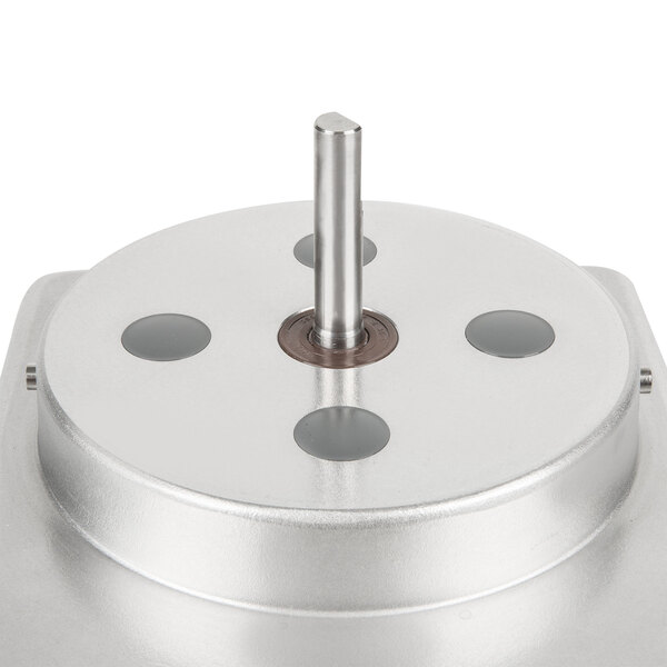 A stainless steel metal bowl with a metal pole inside.