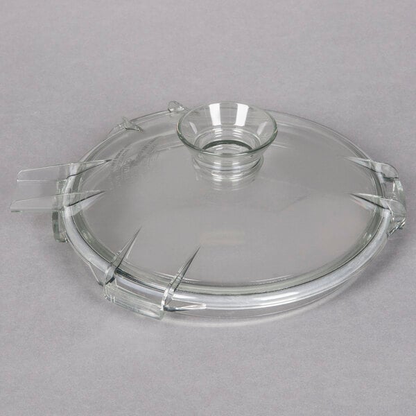 A clear glass lid on a Robot Coupe food processor bowl.