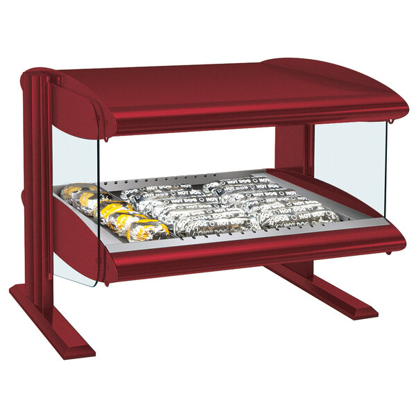A red Hatco countertop heated zone display case with food on a shelf.