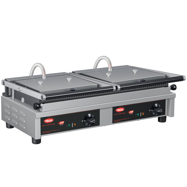 A Hatco double panini grill with grooved cast iron plates on a table.