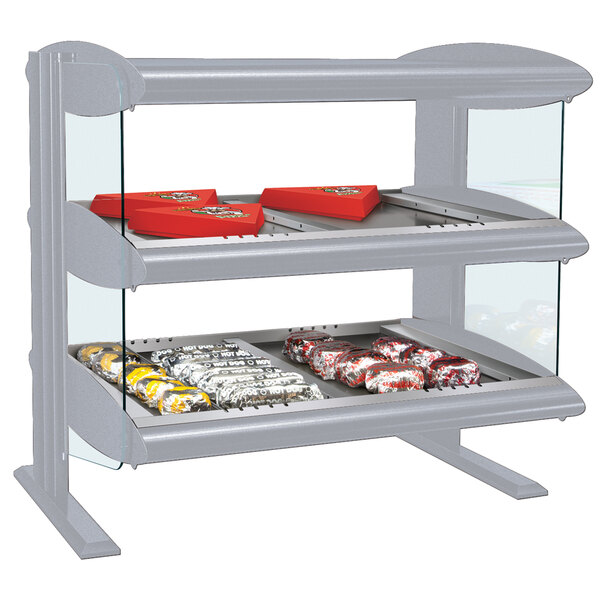 A Hatco heated zone merchandiser with food on two shelves.
