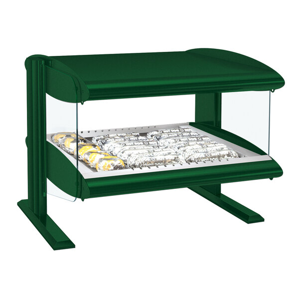 A Hatco green heated zone merchandiser with food on a shelf.