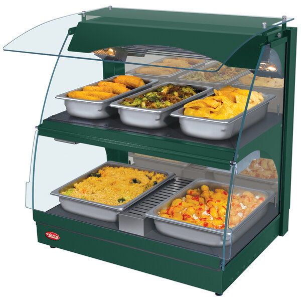 A Hatco Green Glo-Ray double shelf countertop food warmer displaying food.