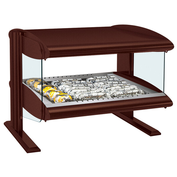 A Hatco heated zone merchandiser with food on a tray in a glass display case.