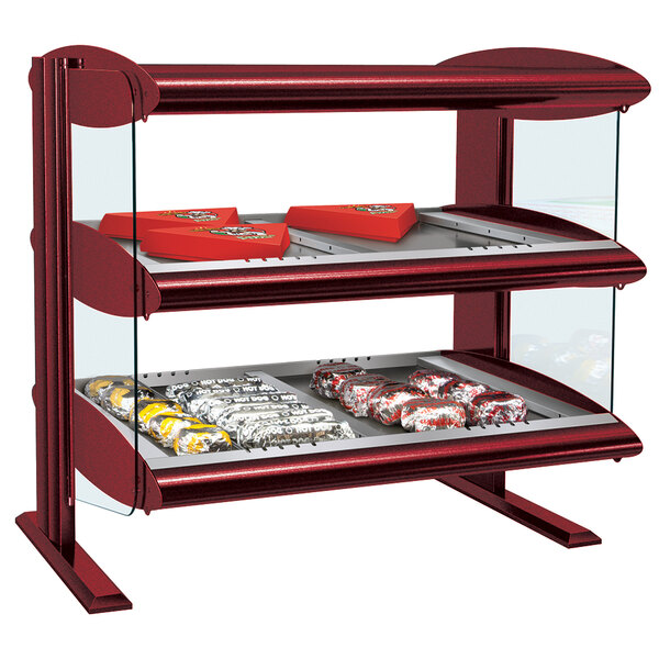 A red Hatco countertop display case with food on two shelves.