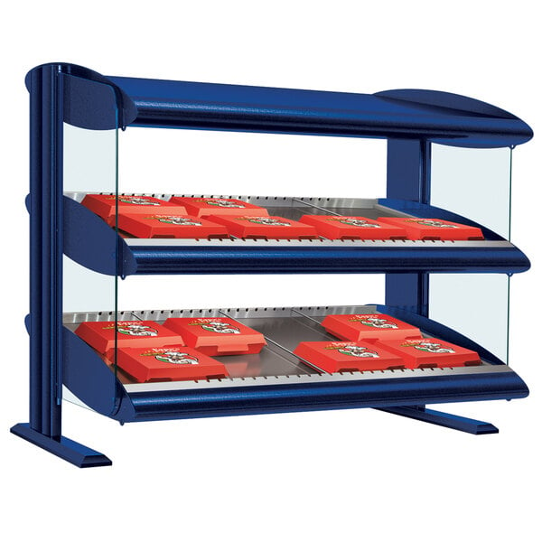 A navy blue Hatco slanted double shelf merchandiser on a counter.