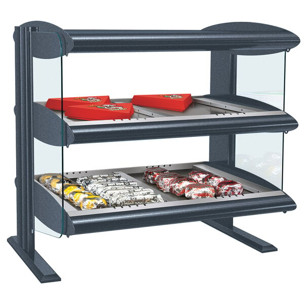 A Hatco countertop heated zone merchandiser with food on shelves.