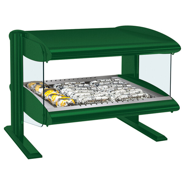 A green Hatco countertop food warmer with a glass top over a tray of food.