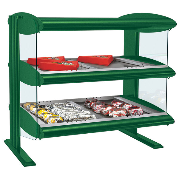A green Hatco countertop display case with food in it.
