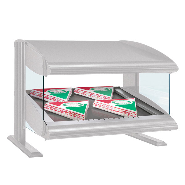 A Hatco white granite countertop heated zone merchandiser shelf with pizza boxes inside.
