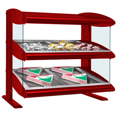A red Hatco countertop heated food display case with food on slanted shelves.