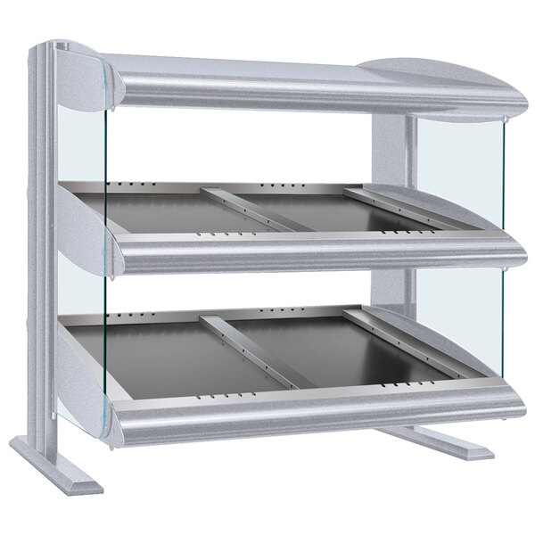 A white granite double shelf heated zone merchandiser on a bakery counter.