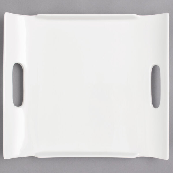 A white rectangular porcelain tray with two handles.