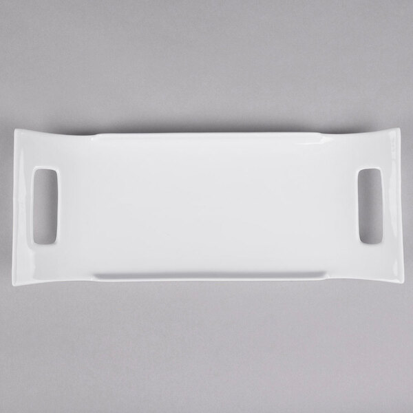 A white rectangular porcelain platter with two handles.
