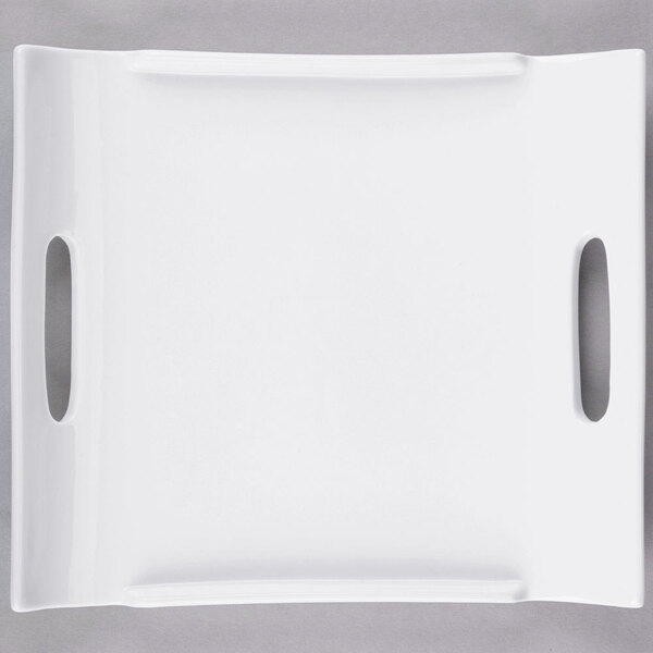A white rectangular porcelain platter with two handles.