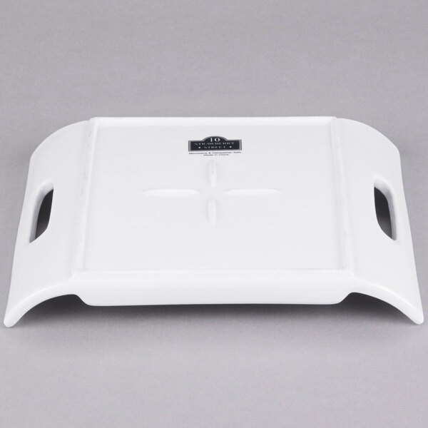 A white rectangular porcelain tray with two handles.