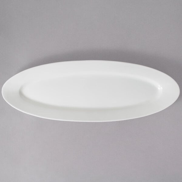 A close up of a white oval 10 Strawberry Street porcelain fish platter.