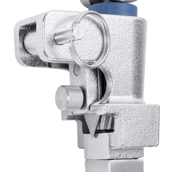 An Edlund commercial can opener with a metal clamp and blue handle.