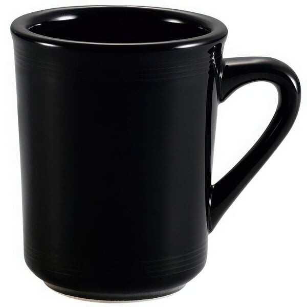 A black CAC Tango coffee mug with a handle.