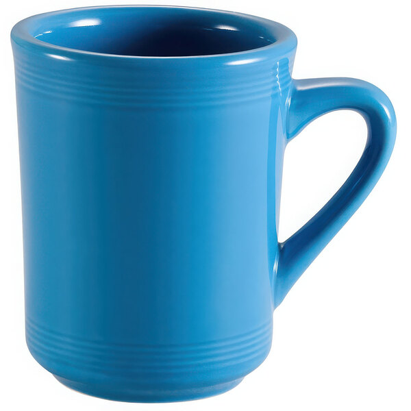 A CAC Tango peacock mug in blue with a handle.
