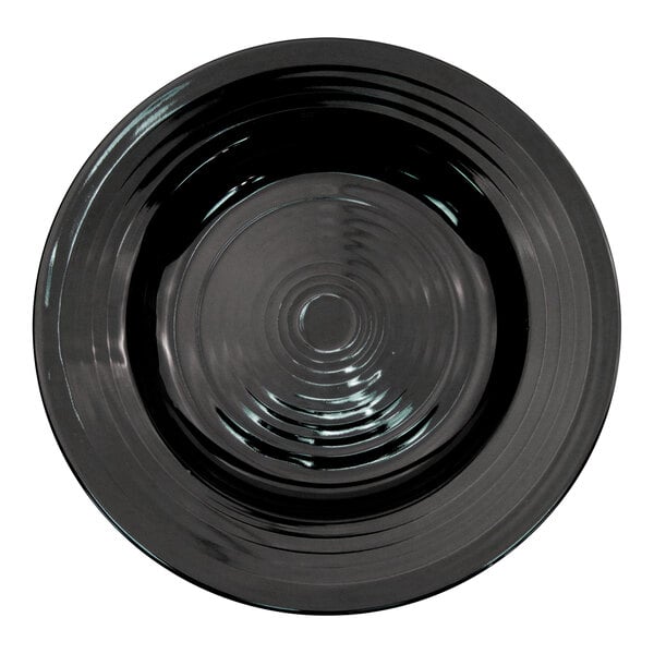A black pasta bowl with a spiral pattern.