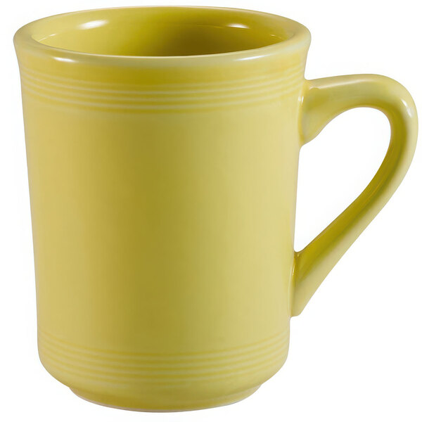 A close-up of the handle of a yellow CAC sunflower mug.