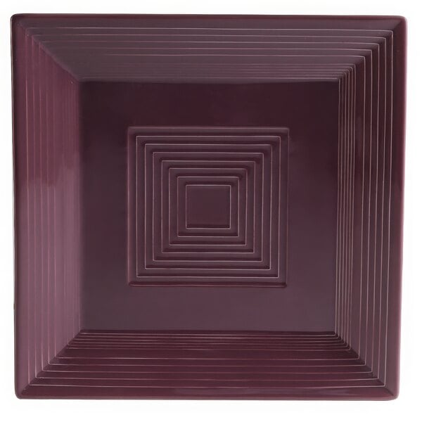 A square plum porcelain plate with a square pattern of lines.