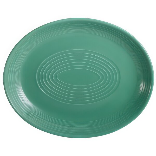 A green oval platter with a white spiral design.