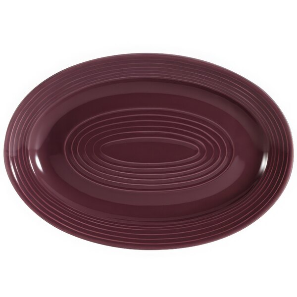 A white oval platter with a purple rim.