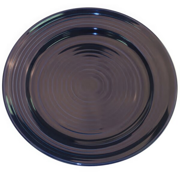 A cobalt blue CAC porcelain plate with a circular pattern.
