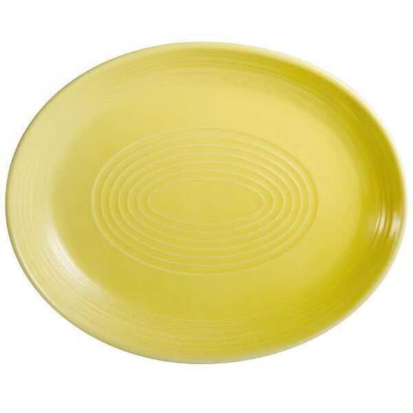 A yellow oval platter with a sunflower design in white.