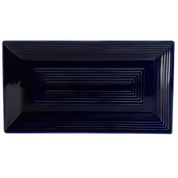 A black rectangular platter with cobalt blue lines.