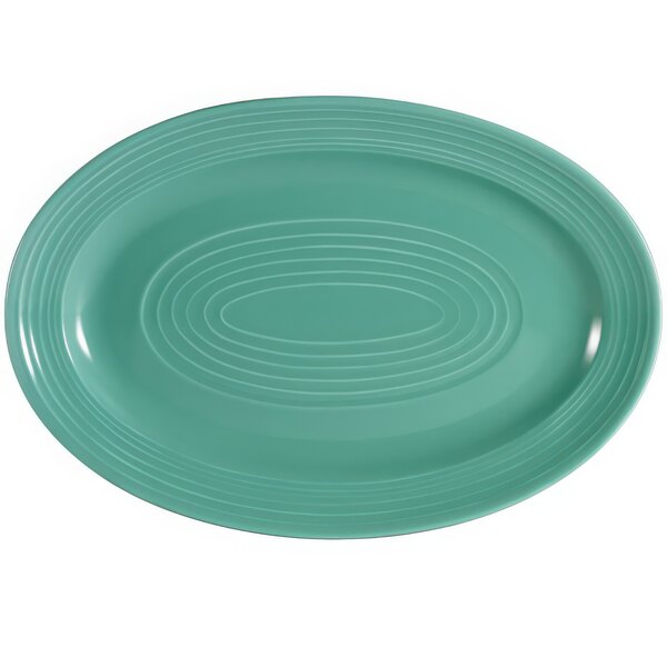 A green oval platter with a white spiral pattern.