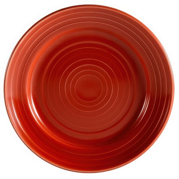 A red plate with a spiral pattern.