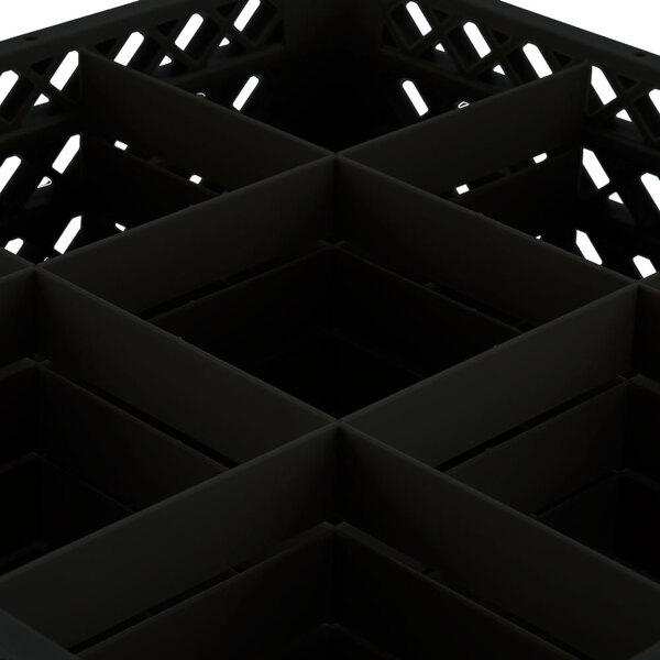 A black plastic Vollrath Traex glass rack with 9 compartments.