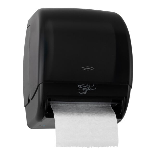 A dark translucent paper towel dispenser with a roll of paper towels inside.