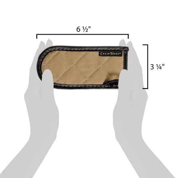 A hand holding a small brown and tan San Jamar BestGuard cotton handle holder.