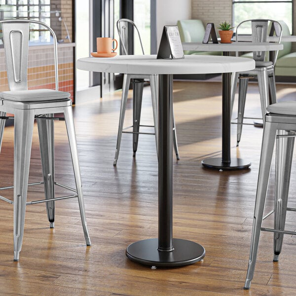 A Lancaster Table & Seating black cast iron bar height table base.