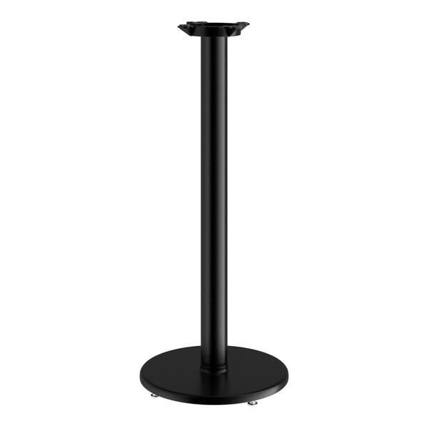 A Lancaster Table & Seating black cast iron bar height table base with a round base and pole.