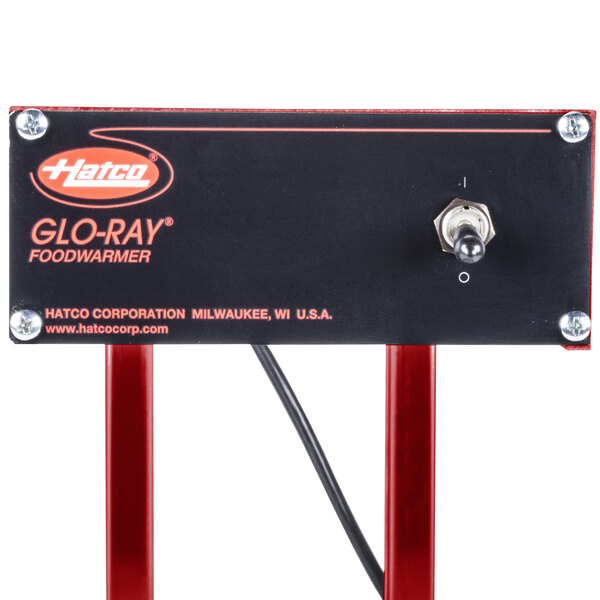 A black rectangular Hatco Glo-Ray french fry warmer with red legs.