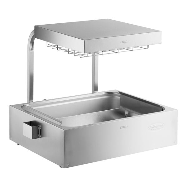 A stainless steel Hatco fry holding station on a counter with a glass shelf.